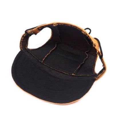 Casquette pour chien / Marley, vue de l'intérieur avec visière noire et bord orange.