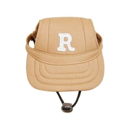 Casquette pour chien Rosco, couleur beige, logo « R » et cordon de serrage sous la visière.